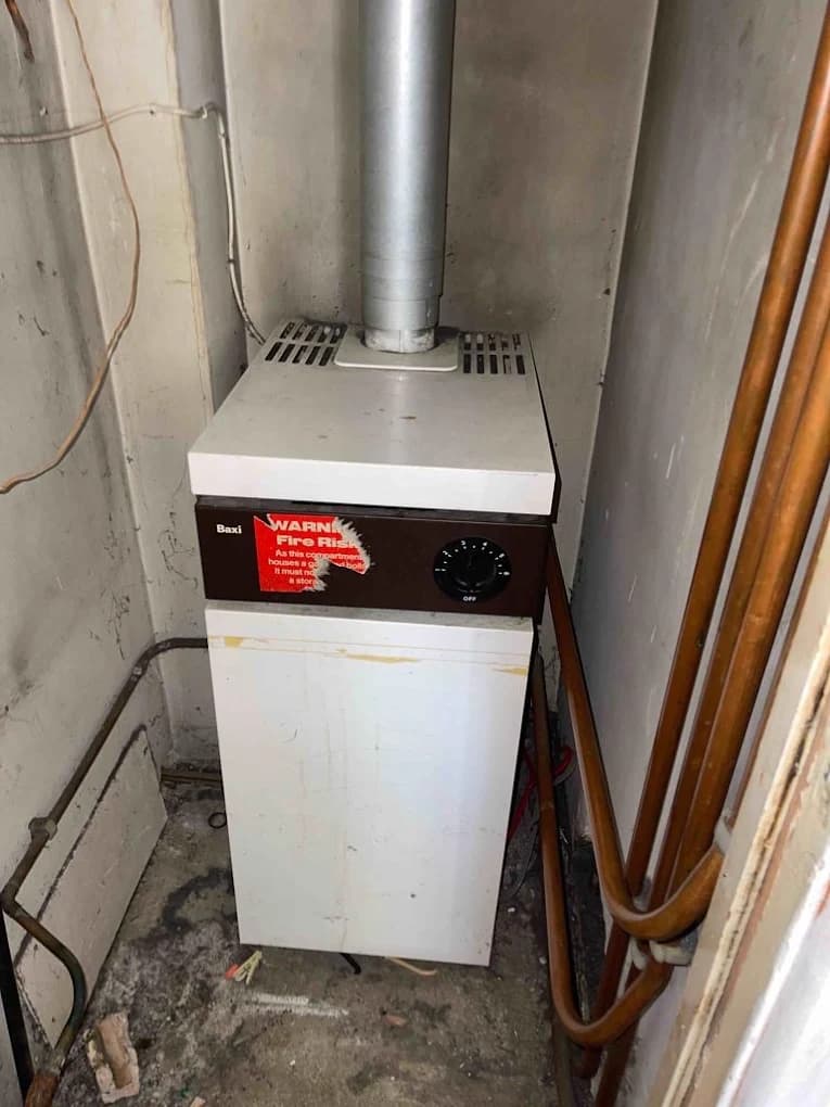 Old back boiler unit before removal