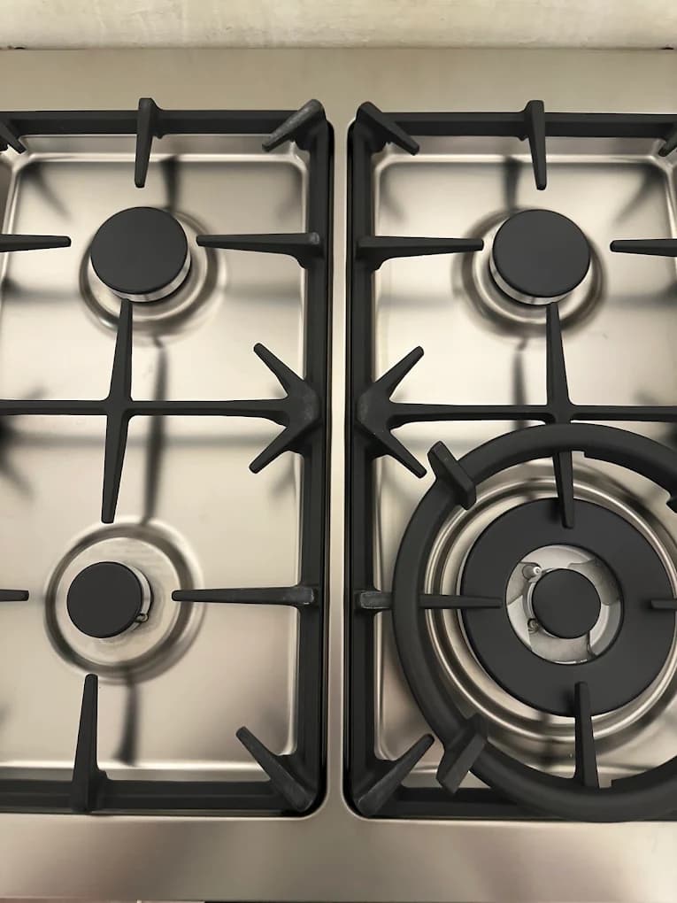 Four burner gas hob installed in a kitchen worktop