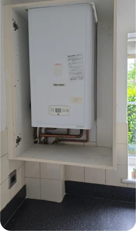 New Glow-worm combi boiler installed in a tidy cupboard